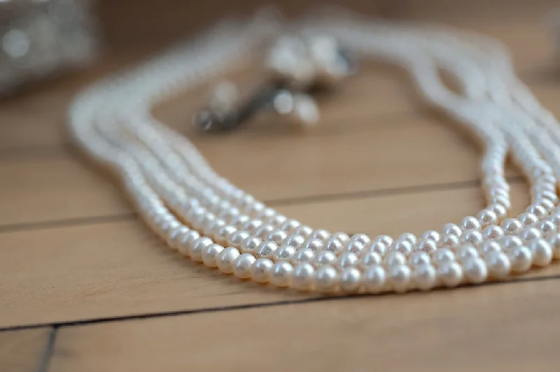 ladies-luxury-necklace-Four Strand Stayed White Pearl Necklace